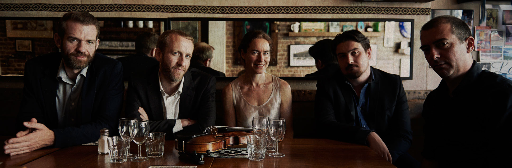 Almagro Ensemble at a table